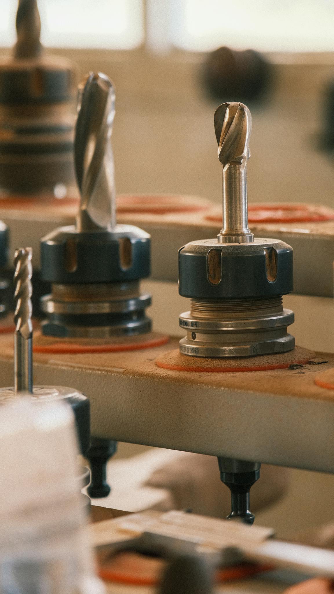 Detailed shot of drill bits in a workshop setting, highlighting precision and technology.